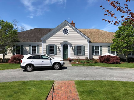 Fall roof cleaning on a Cape Cod, MA home